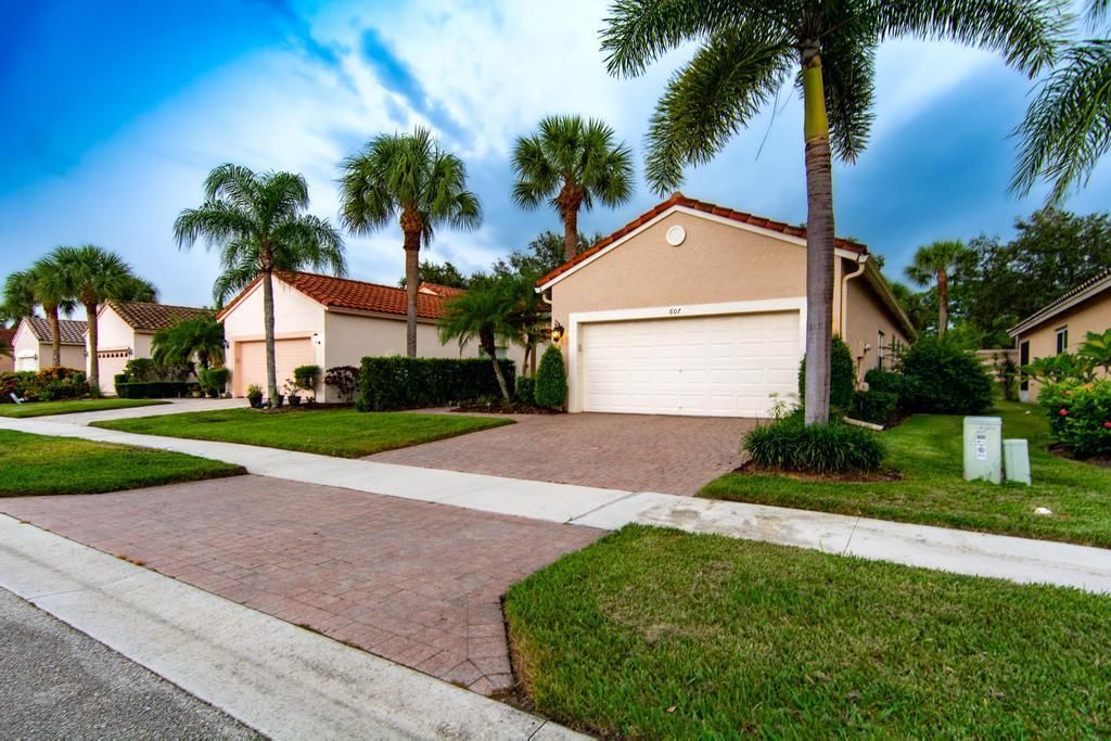 Photo of 607 NW Whitfield Way, Port Saint Lucie, FL 34986 (MLS # R11061837)