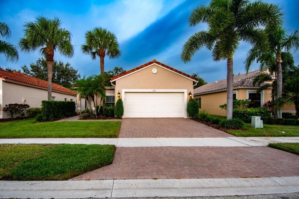 Photo of 607 NW Whitfield Way, Port Saint Lucie, FL 34986 (MLS # R11061837)
