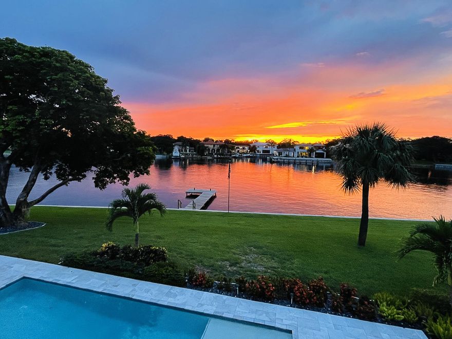 If gorgeous sunsets are what you're looking for then look no further! Offering over 170' of ICW frontage enjoy panoramic views of the waterway from this custom built 4-bedroom + game room, 5.5 bath residence. Designed as a family compound each bedroom has its own ensuite bathroom and walk-in closet. The Chef's kitchen has high end Stainless appliances, a large center island with expansive counter space and a six-seat breakfast bar. Other amenities include a large game room with full wet bar, custom pool with sun shelf, a wine cellar, full impact doors and windows and a Generac generator.