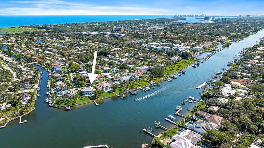 If gorgeous sunsets are what you're looking for then look no further! Offering over 170' of ICW frontage enjoy panoramic views of the waterway from this custom built 4-bedroom + game room, 5.5 bath residence. Designed as a family compound each bedroom has its own ensuite bathroom and walk-in closet. The Chef's kitchen has high end Stainless appliances, a large center island with expansive counter space and a six-seat breakfast bar. Other amenities include a large game room with full wet bar, custom pool with sun shelf, a wine cellar, full impact doors and windows and a Generac generator.