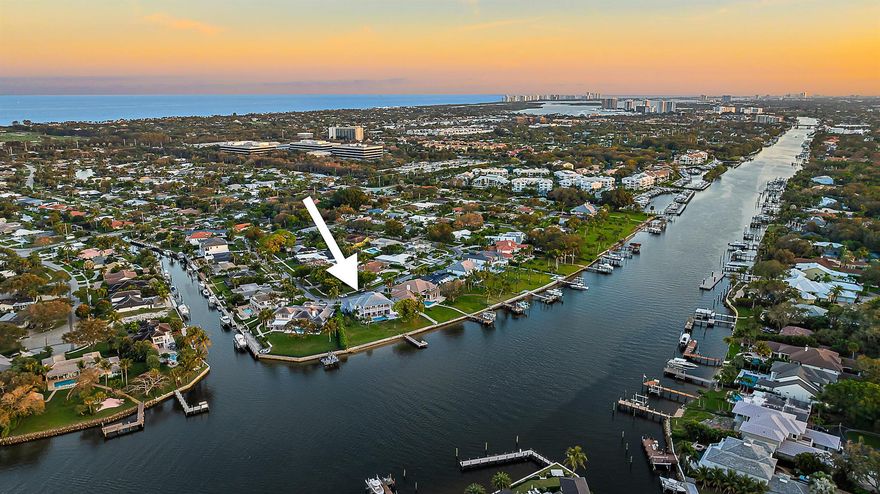 If gorgeous sunsets are what you're looking for then look no further! Offering over 170' of ICW frontage enjoy panoramic views of the waterway from this custom built 4-bedroom + game room, 5.5 bath residence. Designed as a family compound each bedroom has its own ensuite bathroom and walk-in closet. The Chef's kitchen has high end Stainless appliances, a large center island with expansive counter space and a six-seat breakfast bar. Other amenities include a large game room with full wet bar, custom pool with sun shelf, a wine cellar, full impact doors and windows and a Generac generator.