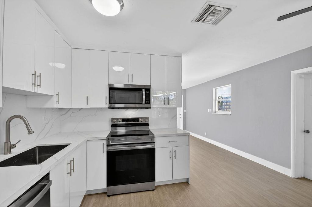 Photo of 312 Greenbrier Drive, Palm Springs, FL 33461 (MLS # R11152879)