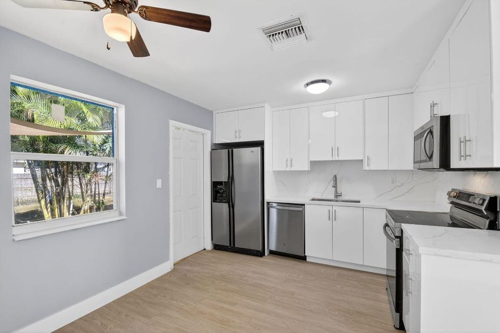 Photo of 312 Greenbrier Drive, Palm Springs, FL 33461 (MLS # R11152879)