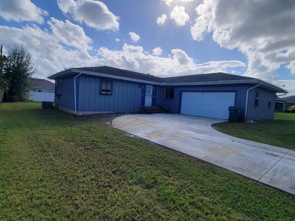 Photo of 1298 SW Parma Avenue, Port Saint Lucie, FL 34953 (MLS # R10930354)