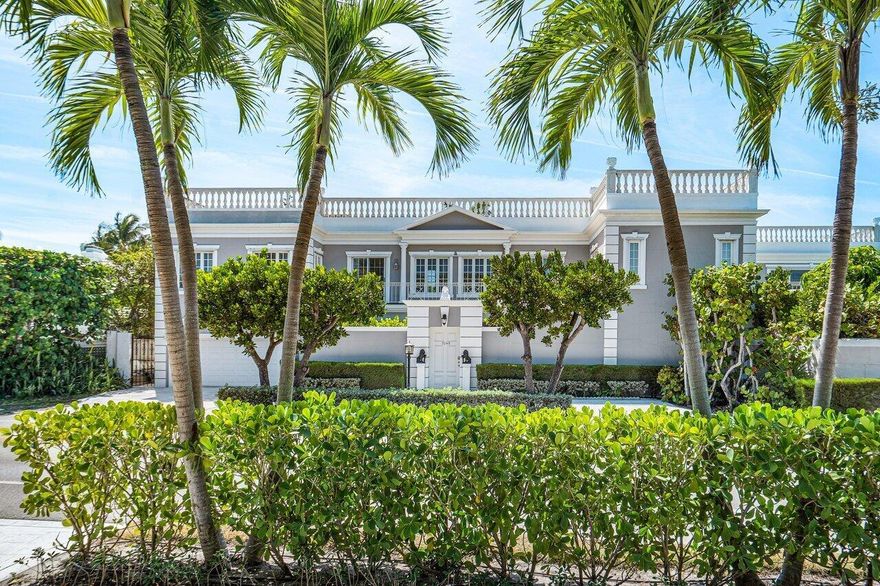 Beautiful John Volk Regency home with ocean views and beach access. Just three streets North of Mar-a-Lago in the Estate Section, this five bedroom, six full and two half bathroom home is ideal for entertaining. A 40 x 20 foot pool and two upstairs balconies with direct ocean views. Just steps away from a private beach deeded beach access.