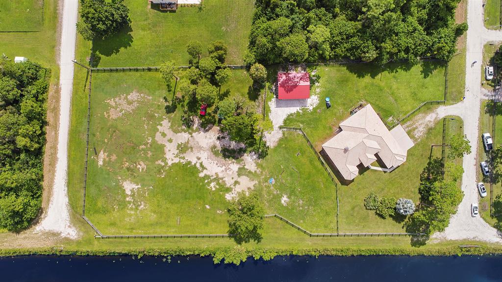 Private 1.48 Acre Lot Already cleared at the end of the road with approximately 240' of canal frontage. Lot directly to the north is for sale and Adjoining property to the south with a home already built is also available MLS # RX-10458921.
