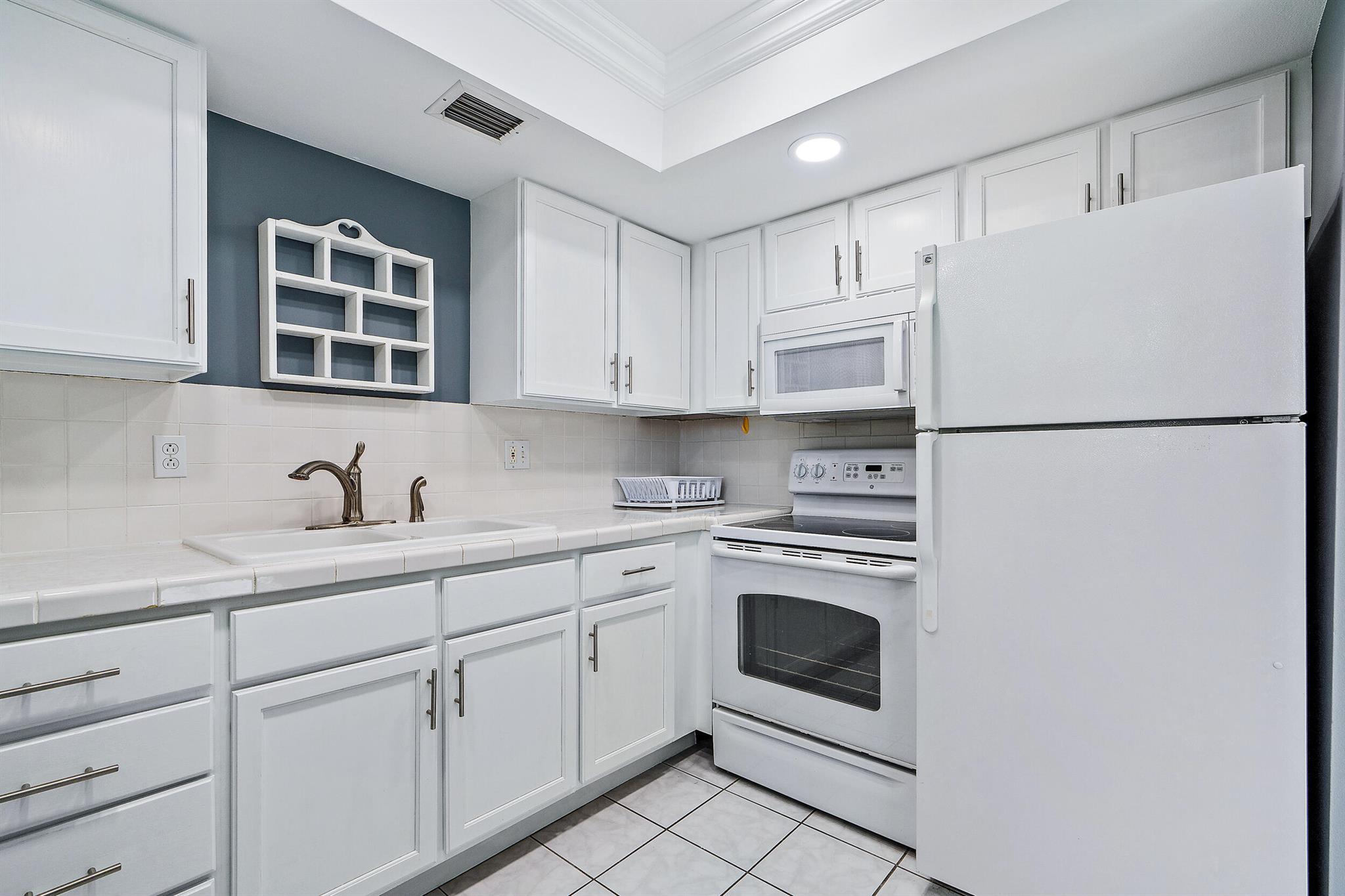 Beautiful 2nd story corner with new upgrades! Light & bright, this 55+ condo in the ever popular Cedar Pointe is close to everything! Golf, restaurants, beaches, shopping, airports, hospital, churches, doctors, you name it. Amenities include a clubhouse with pool and shuffleboard. Shower door installed after photos were taken.