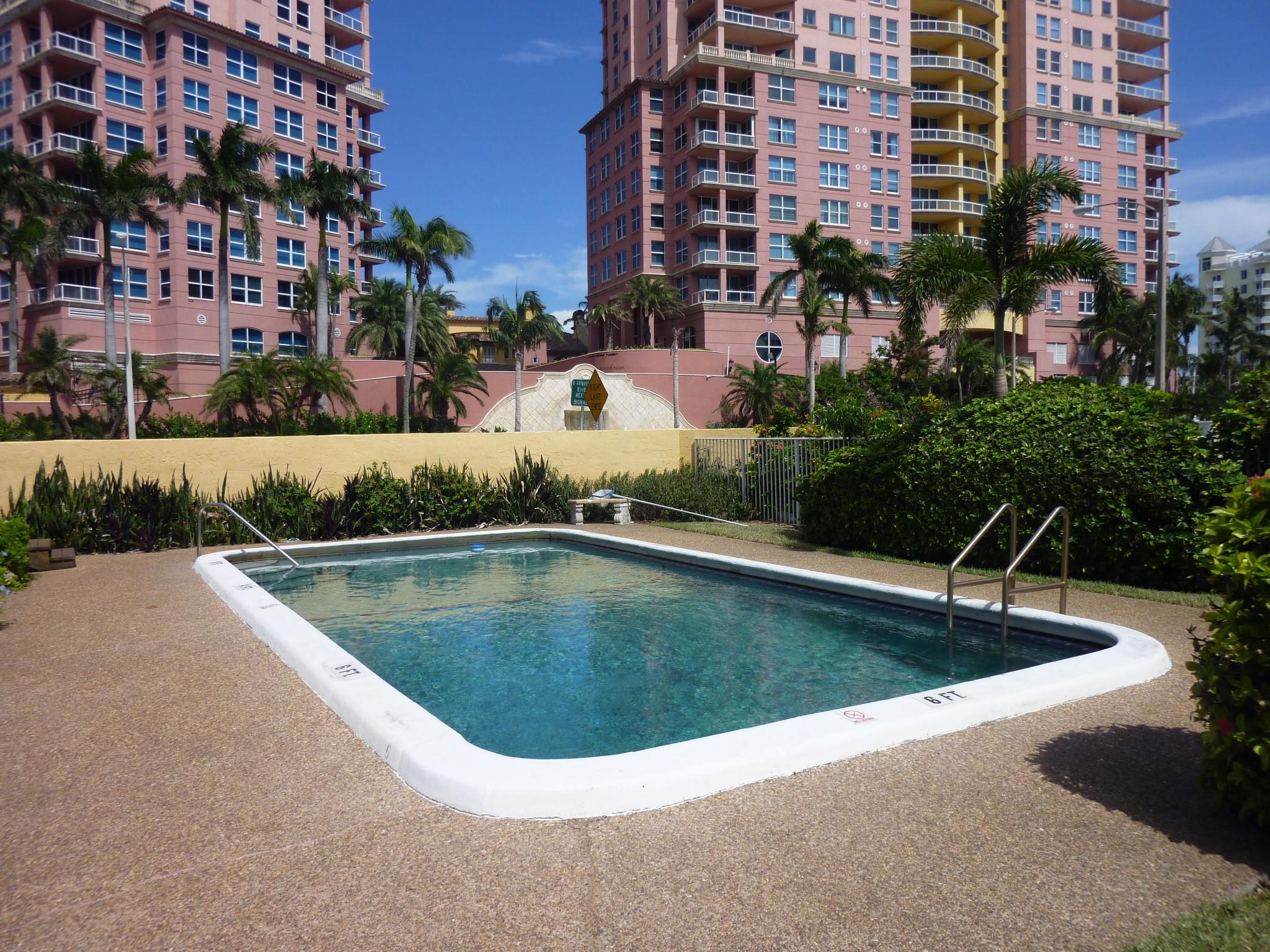 Beachside boutique living at its finest. This nicely remodeled corner unit is located in a charming two-story building directly across from the prestigious Auberge Beach Resort with convenient beach access. The residence features a beautifully updated kitchen with high-end stainless steel appliances, granite countertops, and soft-close cabinetry. The bathroom has been tastefully remodeled, and impact windows throughout provide abundant natural light. Additional highlights include a large storage closet, assigned parking with guest spaces, on-site laundry, and a community pool for your relaxation.
