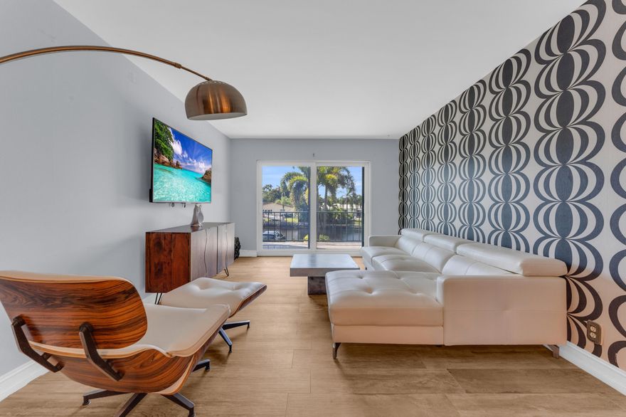 'WATER TURNKEY CONDO IN THE HEART OF WILTON MANORS'' This move-in-ready residence, featuring a bright and open layout, updated kitchen and bathrooms, and the convenience of an in- unit washer and dryer - a rare upgrade in the community.  Enjoy serene water views from your living space and experience the best of South Florida living just minutes from Wilton Dr, dining, and entertainment. perfect as a primary residence, vacation or investment opportunity. Direct waterfront Fully updated interior Turnkey - sold furnished In-unit washer & dryer Prime location in buildin C