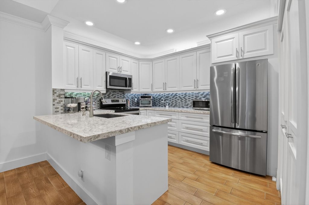 Photo of 20220 Boca West Drive #201, Boca Raton, FL 33434 (MLS # B26008673)