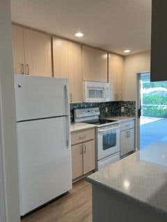 Photo of 3558 Wildwood Forest Court #A, West Palm Beach, FL 33403 (MLS # B26040150)