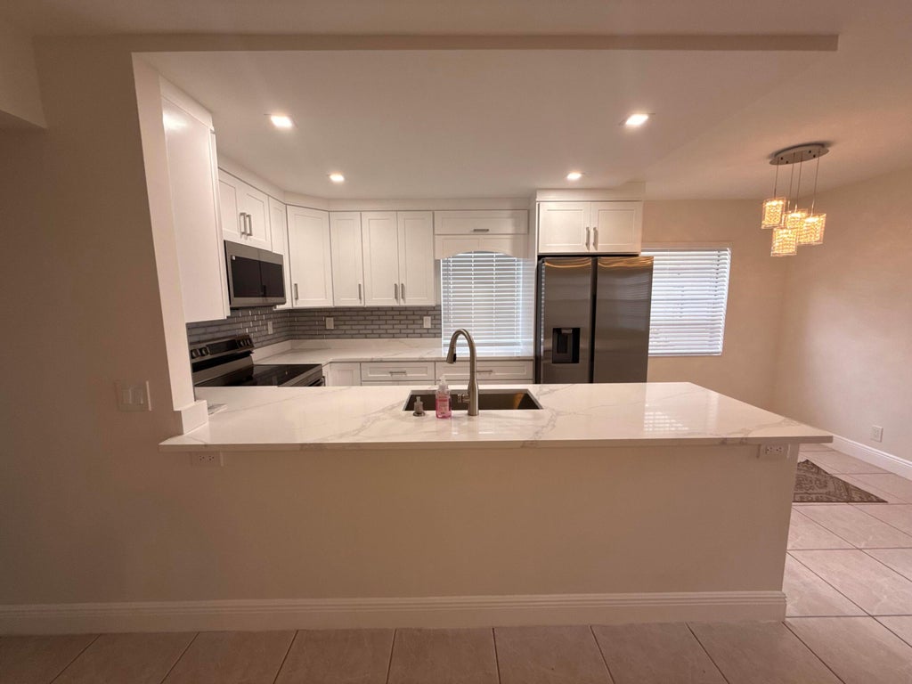 Photo of 358 NORMANDY H, Delray Beach, FL 33484 (MLS # B26052184)