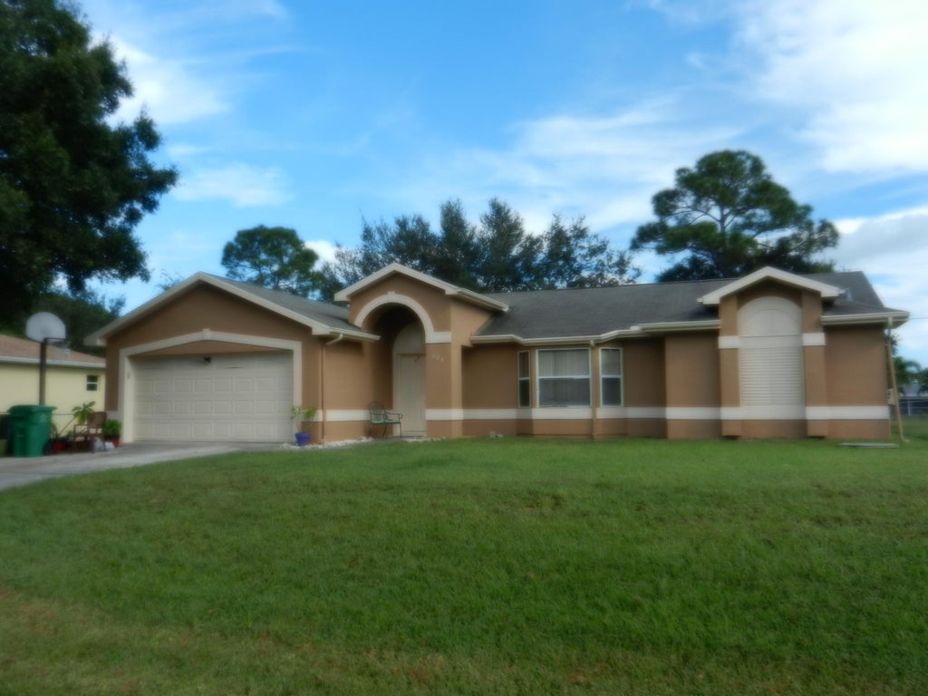 Photo of 305 SW Duxbury Avenue, Port Saint Lucie, FL 34983 (MLS # R10780724)