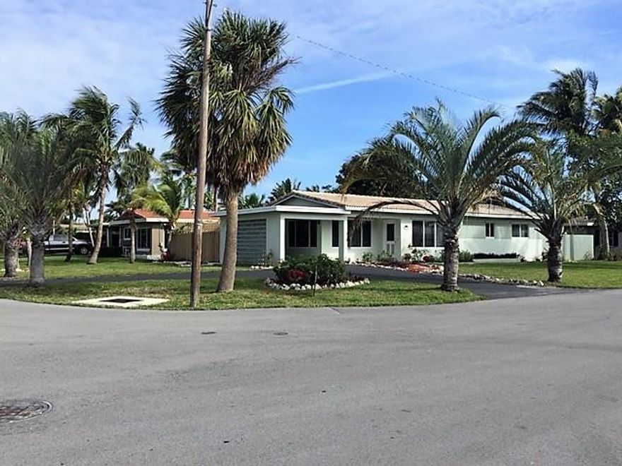 Large corner lot 3/2 with carport and screened in patio.  All impact windows. Floranda neighborhood.
