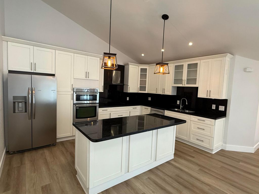 Photo of 5138 Woodruff Lane, Palm Beach Gardens, FL 33418 (MLS # B26004503)