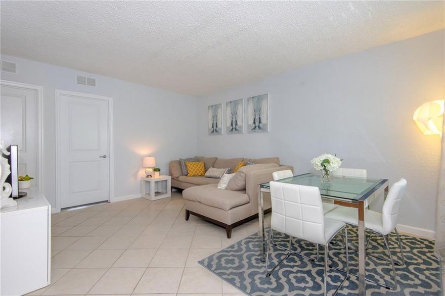 Come see this 2nd floor unit in The Grove. This unit is ready for immediate occupancy.  Just bring your tooth brush.  Tile Floors in main living area. Carpet in bedrooms. The unit features plantation Shutters in the living room & in kitchen. This unit is being sold furnished.  Low condo fee of $288 per month. The community is gated and even has a pool!  Pets Ok!  It's even ok to lease twice per year!  Call today!