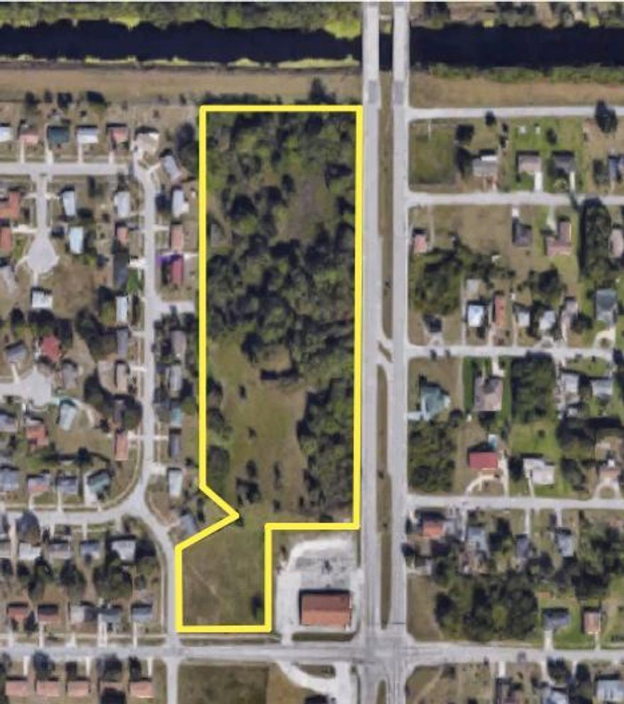 For Sale only at ABSOLUTE AUCTION Wednesday May 23rd at Noon!  9.4+/- acre commercial parcel with water/sewer!  897+ ft. of frontage directly on N 25th Street a major arterial 4-lane divided roadway with median cut and turn lane with access from both north and south bound traffic.  Close to: St. Lucie International Airport, Indian River State College, US Hwy 1, I-95 and Florida Turnpike.  GREAT location just minutes from Historic Downtown Ft. Pierce and beaches.  Sells to the HIGHEST BIDDER...REGARDLESS of PRICE!!