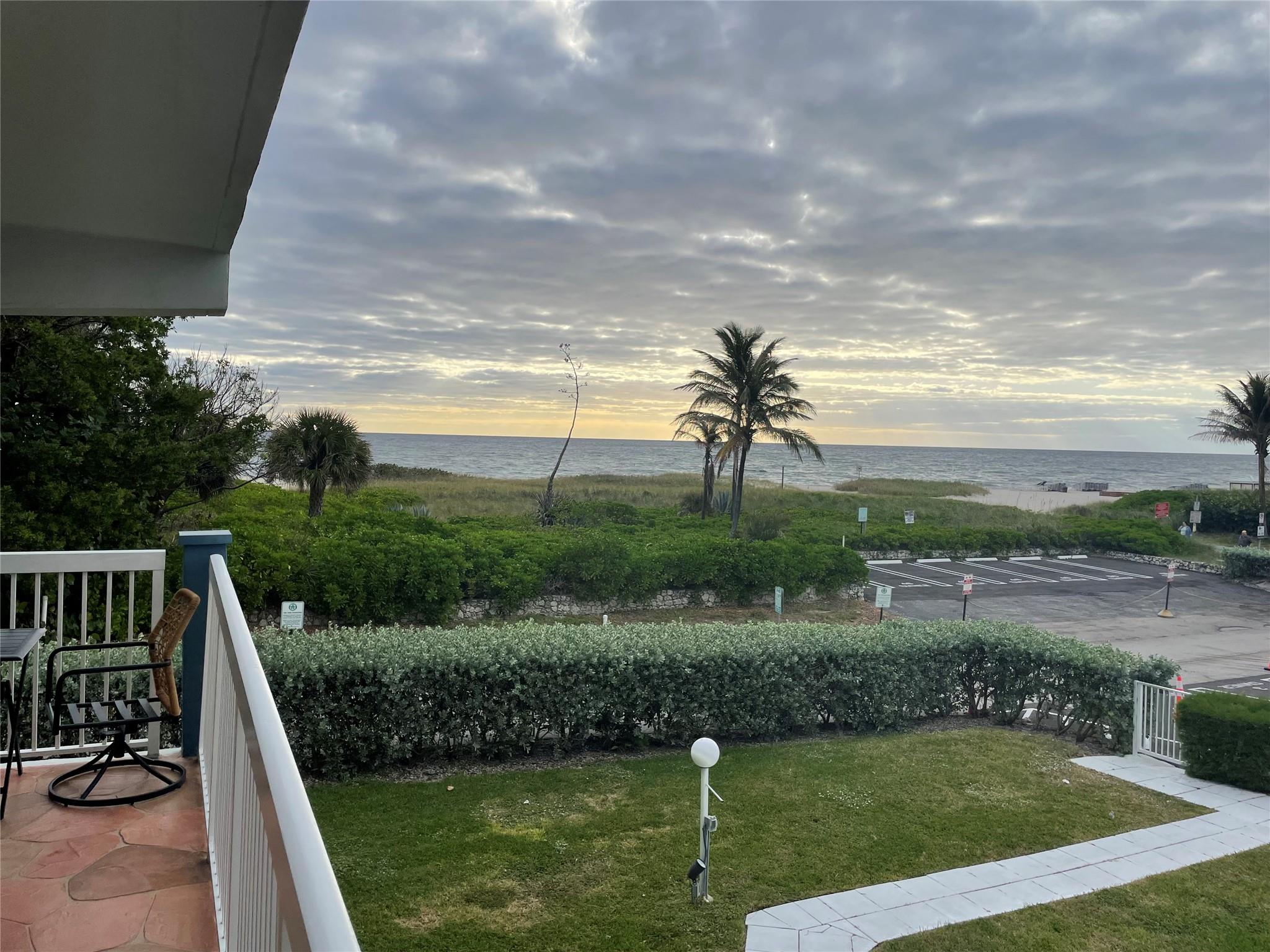 Experience ocean front living at its finest in this beautiful 2 bedroom 2 bath condo, offering panoramic oceanfront views. Wake up each morning to the soothing sounds of the waves and enjoy your coffee while watching the sunrise from you unit. This spacious unit features am open concept living area. Additional amenities include laundry facility, assigned parking, and heated pool. Located just steps from the beach, local dining, shopping and entertainment. Don't miss the chance to make this ocean front paradise your new home!