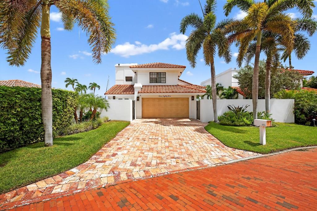 Welcome to 483 Pelican Way — an exceptional waterfront residence located in one of the only gated communities on the Intracoastal in Delray Beach. Perfectly situated on a prized lot with a backyard pool, this home boasts sweeping, panoramic water views that are virtually unmatched.
Step inside to find a light-filled, open floor plan designed to showcase the views from nearly every room. The expansive living and dining spaces feature soaring ceilings, impact glass doors, and seamless flow to the outdoor entertaining areas. A spacious kitchen with multiple indoor-outdoor living spaces invite relaxation and entertaining year-round.
The primary suite is a true retreat, with a private balcony overlooking the water, a spa-like bath with dual vanities, and generous walk-in closets.