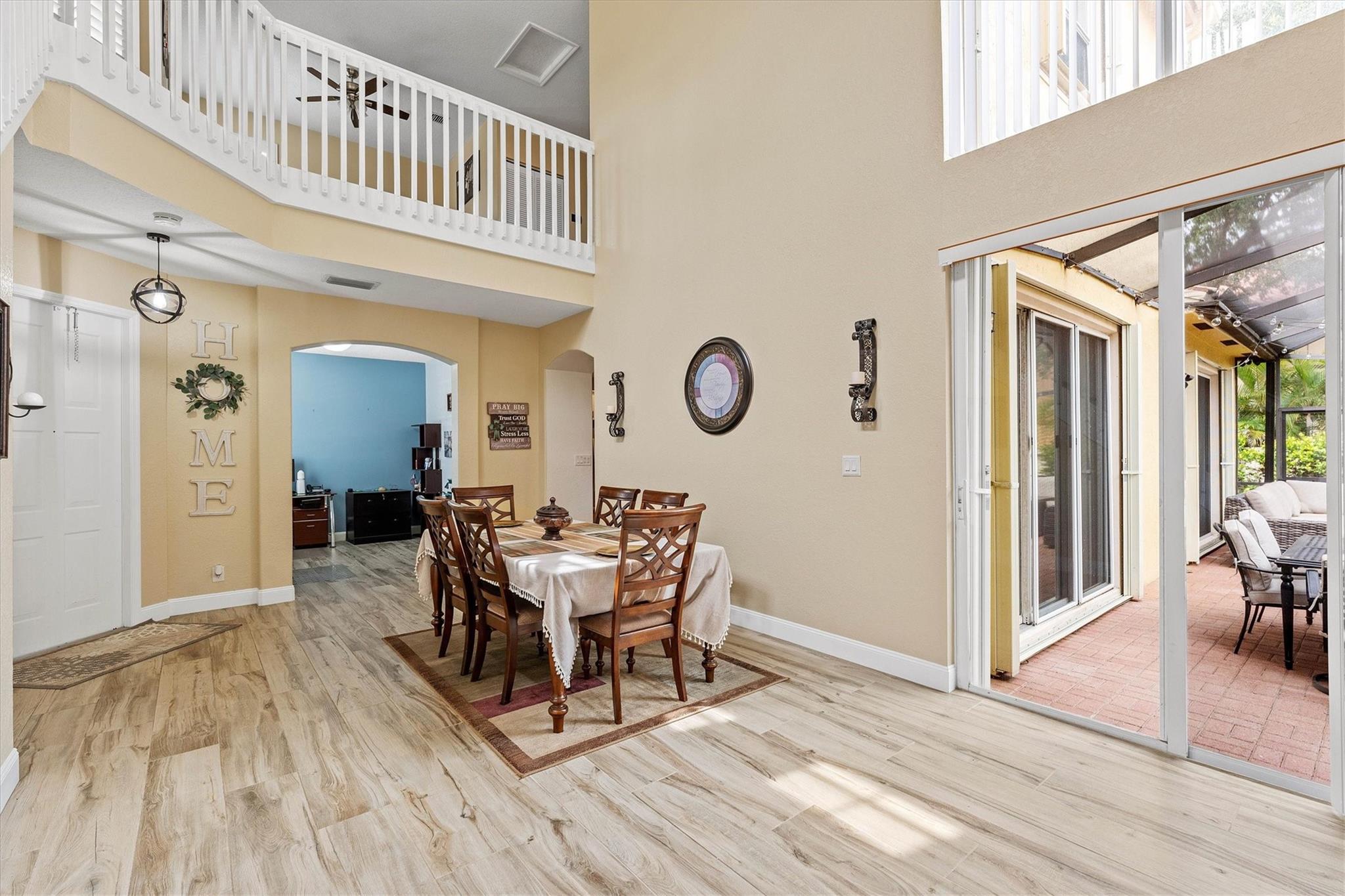 Welcome to HERON BAY, featuring a 3-bed, 2.5-bath home in Coral Springs! Featuring soaring ceilings upon entry, wood-look tile floors, and an open kitchen overlooking the family room. The first-floor primary suite includes a flex space perfect for an office, lounge, or dining area. Upstairs offers two bedrooms and a spacious loft ideal for a movie room, play space, or home studio. Enjoy the screened patio and low-maintenance backyard—perfect for relaxing or entertaining. 2-car garage. Conveniently located near top schools, parks, and shopping.