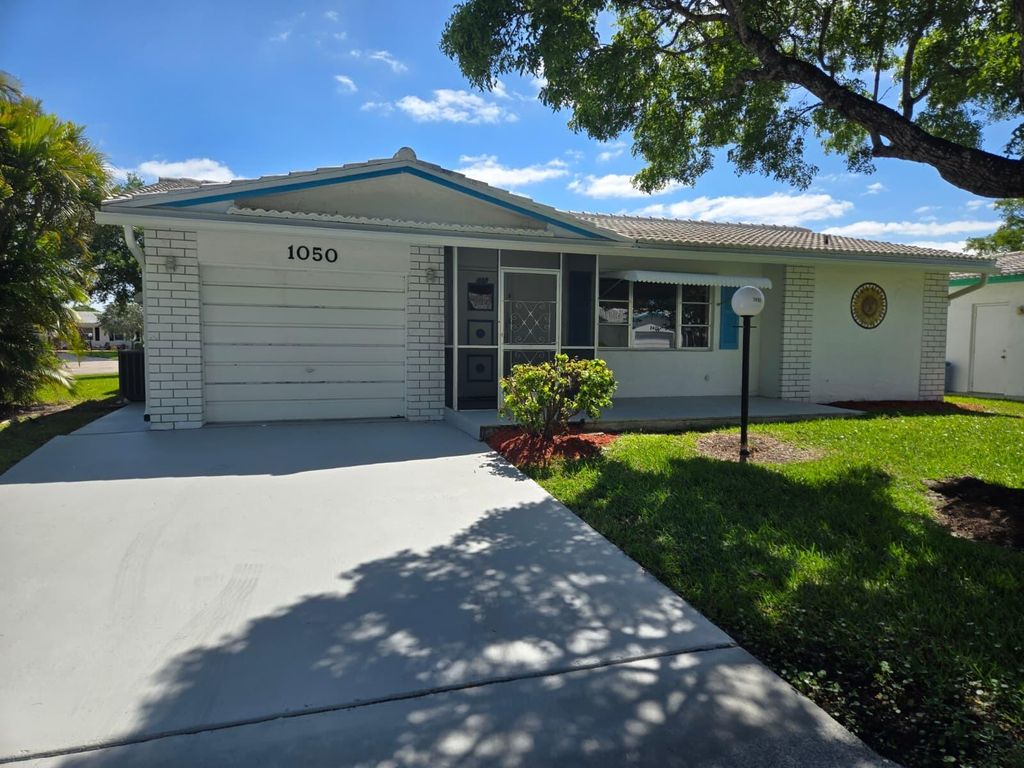 Photo of 1050 NW 90th Way, Plantation, FL 33322 (MLS # B26008691)
