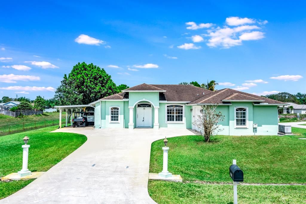 Photo of 2051 SW Logwood Road, Port Saint Lucie, FL 34953 (MLS # R10704834)