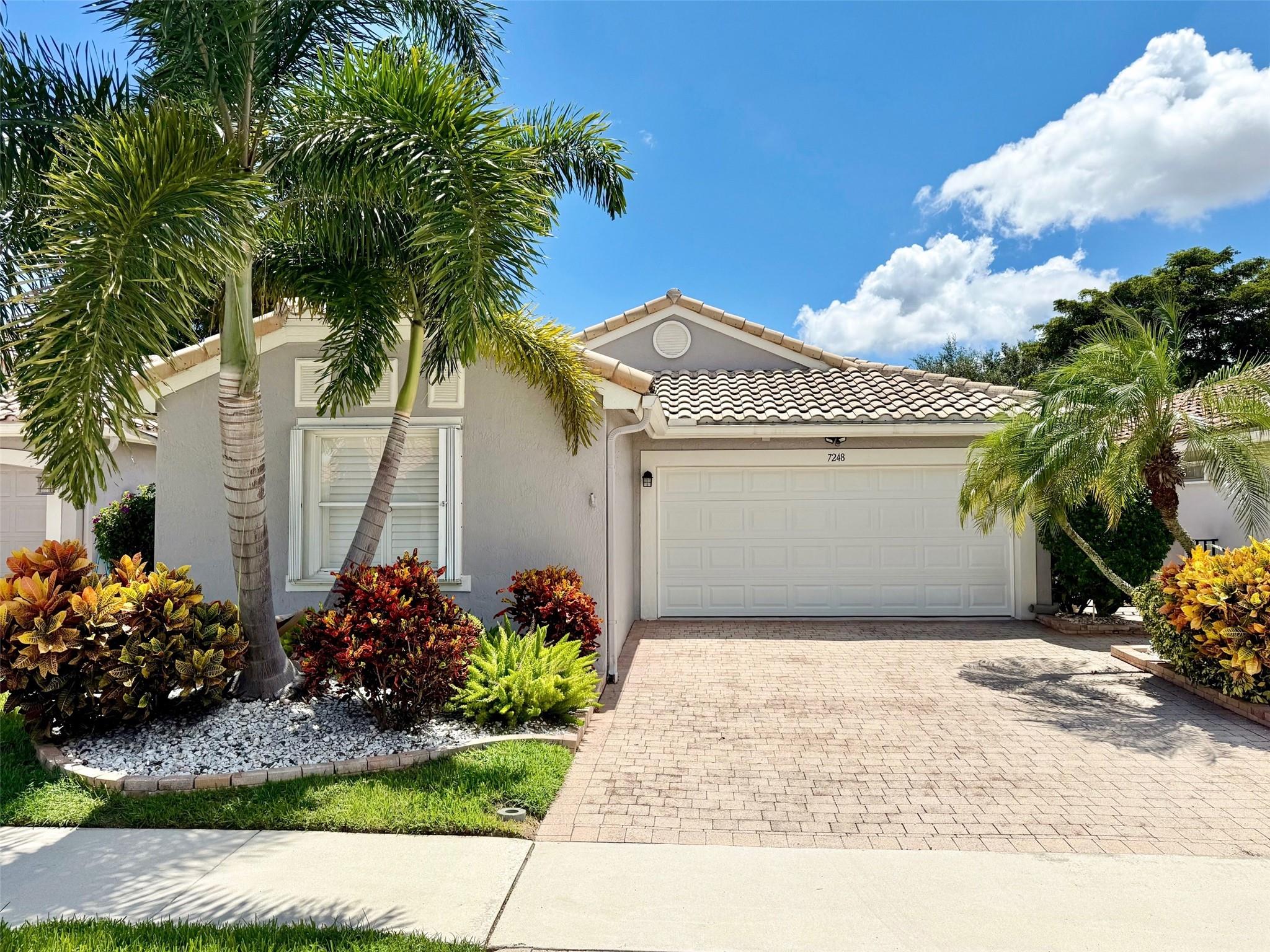 Beautiful 3/2 One-Story Home in the Prestigious 55+ Community of The Cascades! Versatile 3rd Bedroom is used as a Den. Roof Replaced in 2018! Bright & Open w/ Vaulted Ceilings & Tile Floors. Remodeled Eat-in Kitchen, Showcasing Custom Cabinets, Lg Pantry, Granite Counters & Newer Stainless Appliances. Spacious Master Suite includes Plantation Shutters, Walk-in Closets/Shower, Glass Block Window above Tub. Expanded Covered & Screened Patio perfect for Entertaining & Relaxing. Complete Hurricane Accordion Shutters & Garage Door. Located Just Steps to the Satellite Pool & across from Westchester Golf Course. 24-Hour Manned Gate. Renovated Clubhouse, Ballroom, Card & Billiard Rooms, Theater, Fitness Center, Cafe & More! Tropical Resort Style Pool, Pickleball & Tennis. Cable/Internet Included!