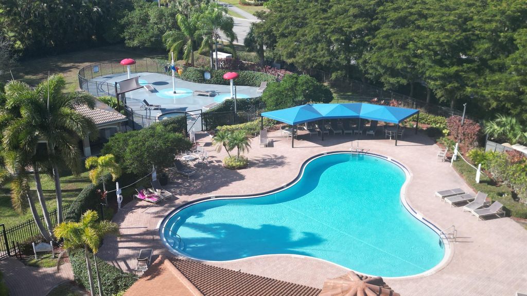 Photo of 5028 Solar Point Drive, Greenacres, FL 33463 (MLS # R11165453)