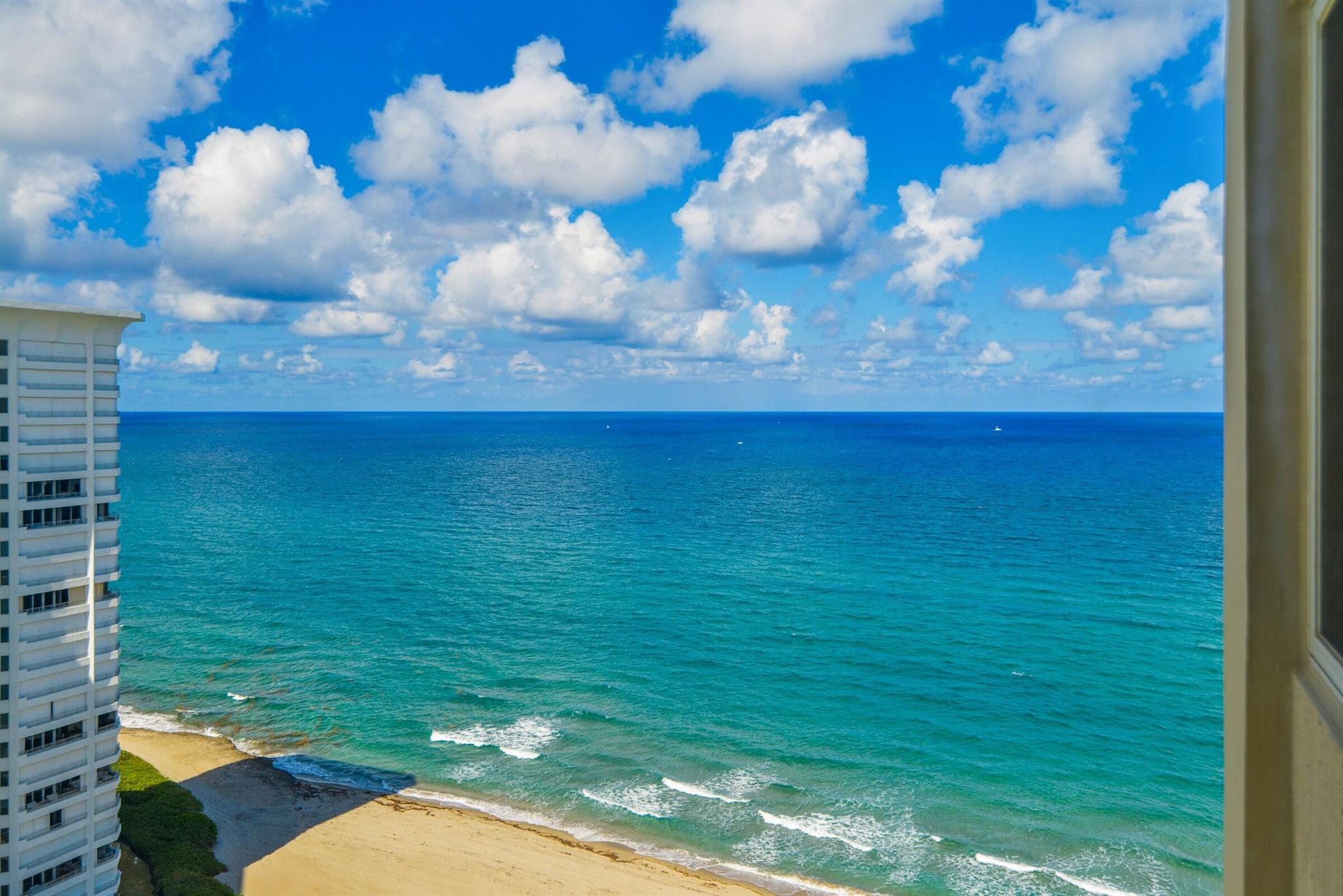 2-bedroom, 2-bathroom condo on the 21st floor offers panoramic ocean vistas from every nook. The expansive terrace serves as a serene vantage point to admire the vast Atlantic. Flooded with natural light, the unit is situated in a premier beachfront building that boasts a modernized lobby, exclusive access to pristine sands, a resort-inspired pool area with a rejuvenating hot tub, a state-of-the-art fitness center, and two well-maintained tennis courts. Enjoy peace of mind with round-the-clock manned security and communal barbecues. Conveniently located, it's just a short stroll to the renowned Boca Raton Beach Club and a bustling downtown filled with gourmet eateries and boutique shopping.