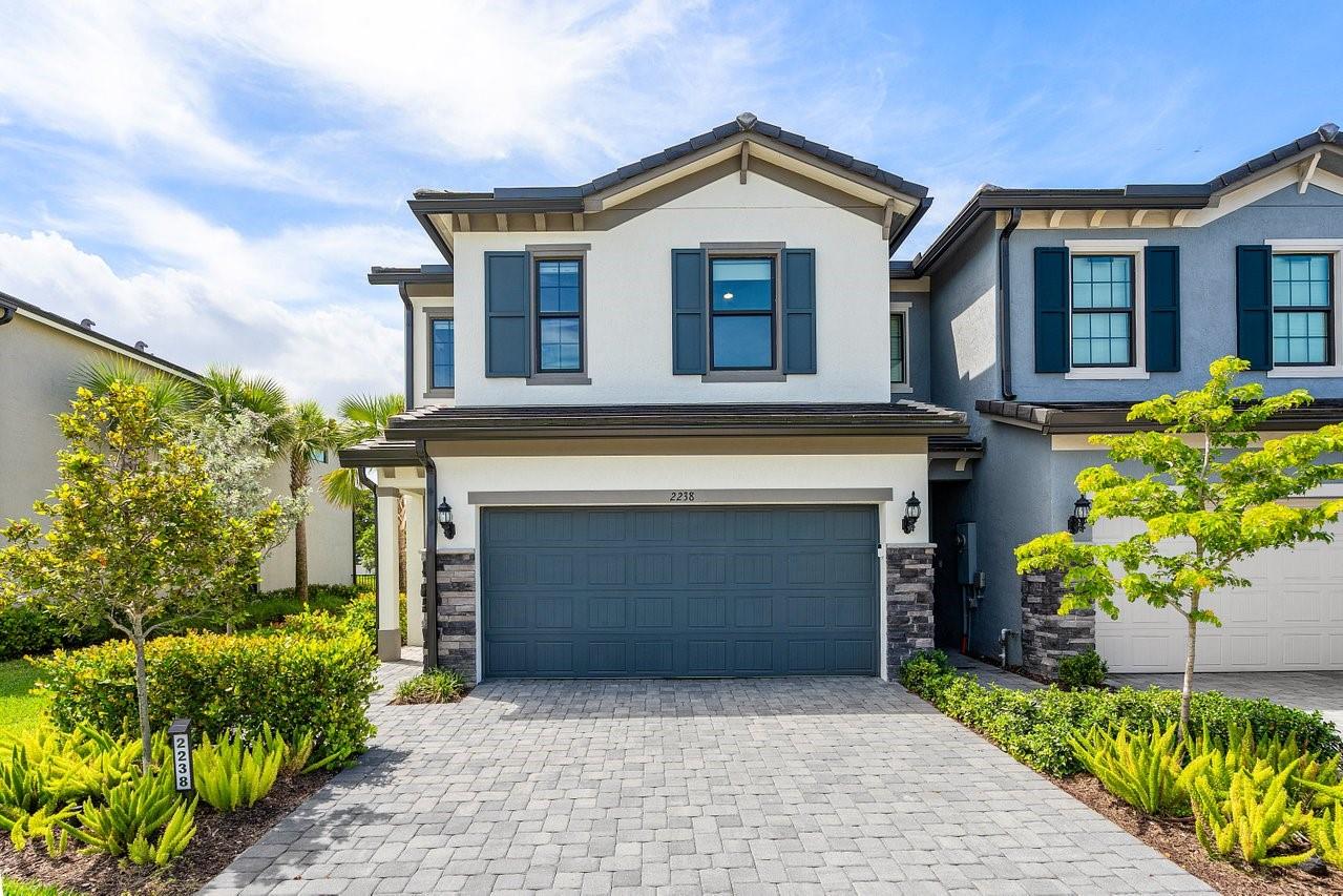 Welcome Home to this "better than new' 3 bedroom 2.5 bath townhome in the gated community of Oak Tree. This home features open concept living on the main level including a gourmet kitchen, Kitchen-Aid appliances, large island. built-in pantry with extra storage and wood grained tile floors throughout. The new wood and metal staircase leads up to your large primary bedroom with custom walk-in closets and a primary bath with separate tub and glass enclosed shower. The separate laundry room, second bath and two other bedrooms, with custom closets, share the upstairs floor. This is a complete "smart" home with motorized shades, LED smart recessed lighting throughout, built-in rear speakers in living room, Ecobee thermostat and tankless water heater. Call today for your private showing.