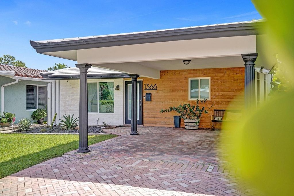 Photo of 1366 NE 39th Street, Oakland Park, FL 33334 (MLS # F10468960)