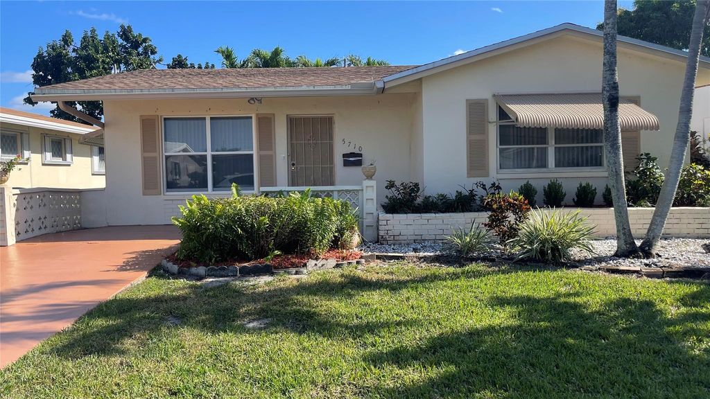 Photo of 5710 NW 68th Ter, Tamarac, FL 33321 (MLS # F10517187)