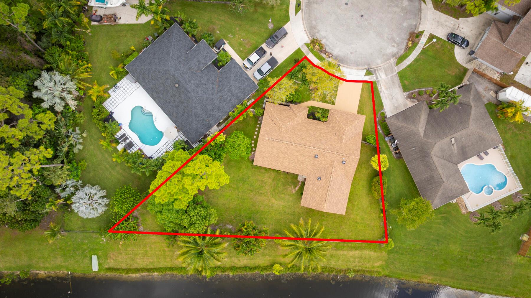 Timeless Avondale Woods single-story gem! Offering over 2,200 sq ft, this 4-bedroom, 2-bath home sits on a spacious 0.7-acre pie lot with serene water views. Newer roof! Featuring solid masonry and stucco construction, an attached garage, central A/C, and forced-air heat, this residence blends classic comfort with endless potential for modern finishes. Located in a quiet Wellington enclave and minutes from A-rated schools, parks, shopping, and the famed equestrian community, the home is perfectly positioned for creating lasting memories. HOA is $460/year. Don't miss the opportunity to revive this property into your dream home in prime Wellington!