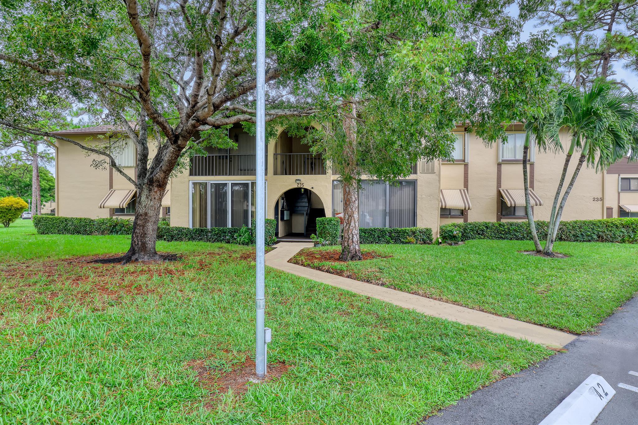 Come see this beautifully maintained 2-bedroom, 2-bath first-floor condo in a popular 55+ community with some of the lowest condo fees around! Perfect for seasonal or year-round living.Enjoy fresh interior paint, updated kitchen cabinets (2022), and fully renovated bathrooms (2024). The A/C and water heater were replaced in 2023, and the condo also features tile flooring throughout, ceiling fans, walking closets, and an enclosed glass patio. The community takes care of exterior maintenance and painting, allowing you to enjoy a low-maintenance lifestyle.
