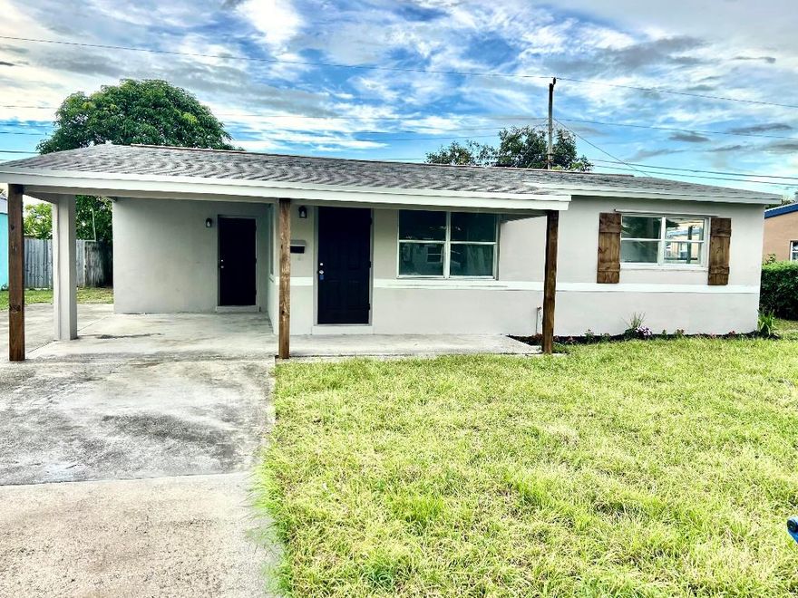 Newly renovated 2 Br 1 bathroom single family home with carport and space for 3 cars.