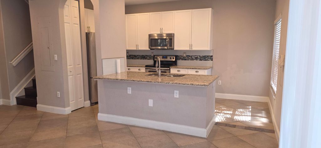 Photo of 219 Lake Monterey Circle, Boynton Beach, FL 33426 (MLS # R11118045)
