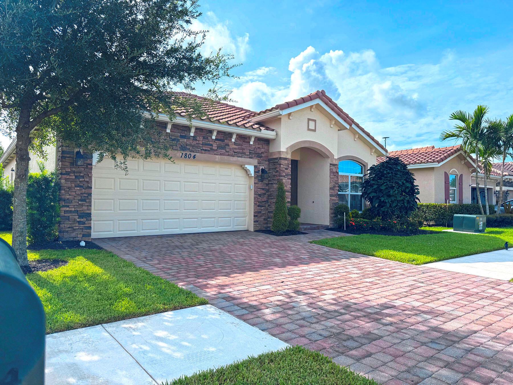 Beautiful, wide lake views from this 2018 Lennar-built home. This Champlain floor plan has 2,079 sq ft, 3 BR, 2.5 BA, and a 2 CG. 10' ceilings, tile throughout living areas, and carpet in BR's. Updated, open kitchen offers new KitchenAid stainless appliances, quartz counters and sink, pendant lighting, and wood cabinetry. Covered lanai leads to an extended paver patio area and a private fenced-in backyard. Community is gated with great amenities, including clubhouse, large pool, fitness room, tennis/pickleball, and more. Low HOA too! Sizes approx./subject to error.