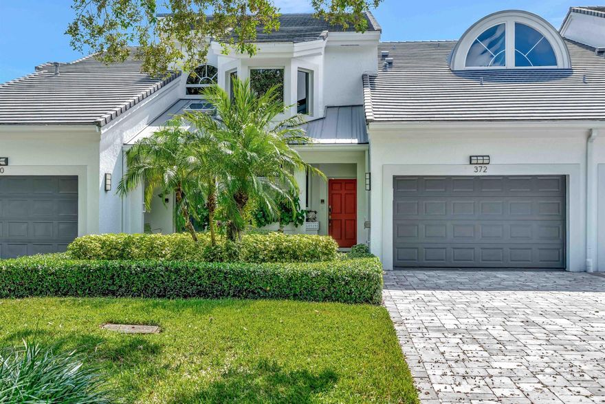 Come home to a beautifully renovated second-floor Harbor Home featuring bright southern exposure and wide water views! This residence offers impact windows, a private elevator, and elegant wood flooring. The custom kitchen showcases rich wood cabinetry, while the primary bath impresses with dual vanities, a freeform soaking tub, and shower. The guest bedroom includes a convenient king-sized Murphy bed, easily converting the space into a home office. Enjoy the screened lanai, perfect for lounging, reading, or savoring your morning coffee and meals al fresco while overlooking the tranquil waters. A boat lift and composite dock accommodate up to a 34-foot boat with ocean access. Ideally located on a quiet, tree-lined cul-de-sac on Spyglass Way, this home benefits from newly painted buildings