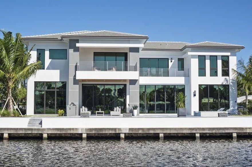 Stunning, brand new construction home in the desired Little Harbor enclave in Deerfield Beach. Situated on a 90 foot deepwater lot with beautiful open water views, featuring 5 bedrooms, 5 baths, 2 half baths, a bonus room and a 3 car garage w. The gourmet kitchen is equipped with Granite and quartz countertops, gas stove and oven, Sub-Zero and Wolf appliances. A guest suite, bonus room, vapor fireplace and wet bar make the first floor the perfect space to entertain. 4 bedrooms all with en-suite bathrooms and walk-in closets as well as a laundry room, complete the second floor. The outside features an large pool, hot tub, covered patio space with summer kitchen, an outdoor shower and 80 feet of dockage. Walking distance to shops, restaurants and beaches.