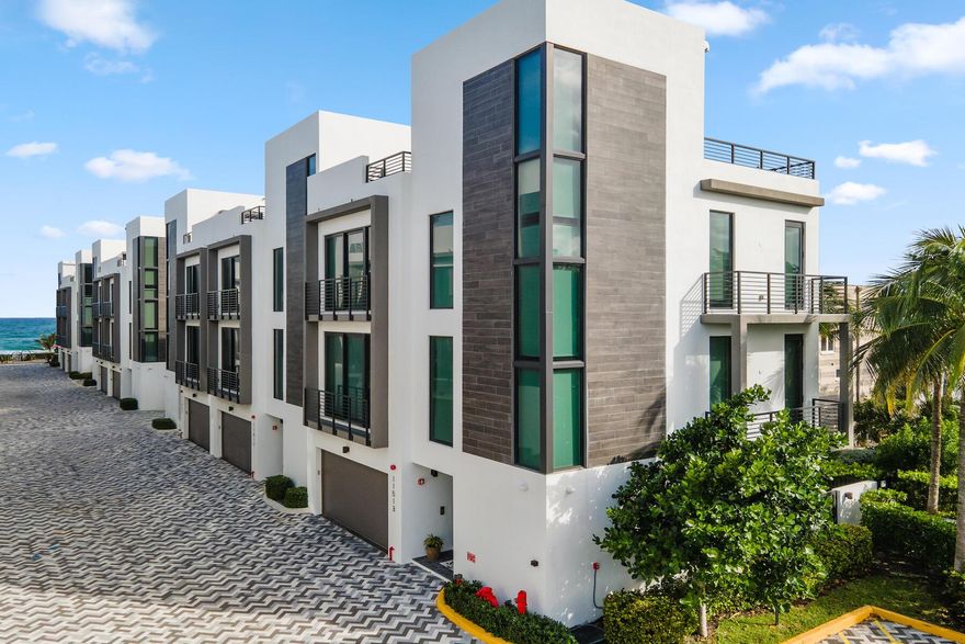 Luxurious oceanfront 3-story corner unit townhome, newly finished in 2022 with high-end upgrades. 4 bedrooms, 4.5 bathrooms, high ceilings, & expansive windows, this residence offers breathtaking ocean views. It features an elevator for easy access across all floors, leading to an opulent rooftop deck perfect for entertaining or sunset relaxation. Inside, a gourmet kitchen with top-of-the-line appliances and spacious en-suite bedrooms, and a spa-like master bath creating a luxurious living experience. Enjoy your very own private heated pool which doubles as a hot tub with ultimate privacy. Exclusive deeded beach access provides a private seaside retreat with an HOA fee inclusive of property insurance (per homeowner) of the exterior while a 2-car garage offers convenience & ample storage.