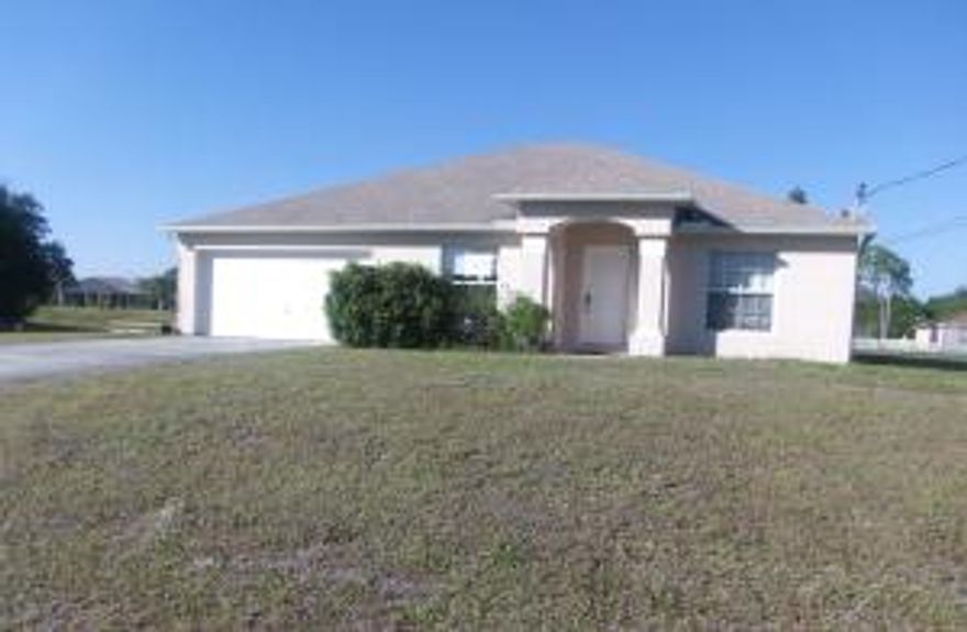 ***Charming 3bed/2bath/2car garage Home*** Property with tile and carpet throughout, kitchen with Corian counter top and Maple cabinets. Formal Living and Dining Areas, Laundry room. House has nice open floor plan and is in moving conditions. Canal in the back. Located: Close to Schools, and Shopping Centers and main roads: Savona Blvd and Port St Lucie Blvd. Come and see it!!!