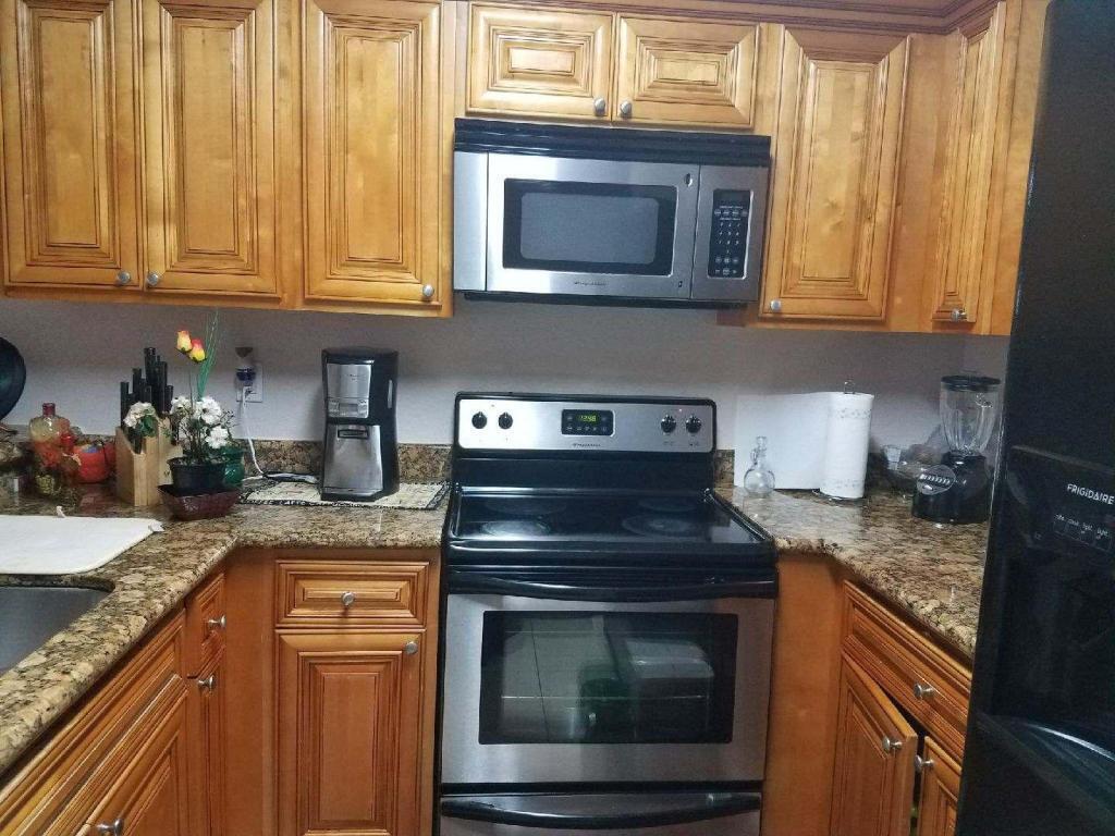 Photo of 1501 WINDORAH Way #C, West Palm Beach, FL 33411 (MLS # B26083038)