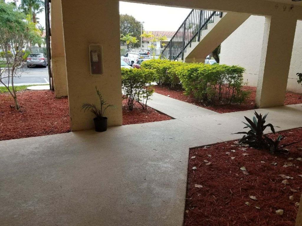 Photo of 1501 WINDORAH Way #C, West Palm Beach, FL 33411 (MLS # B26083038)
