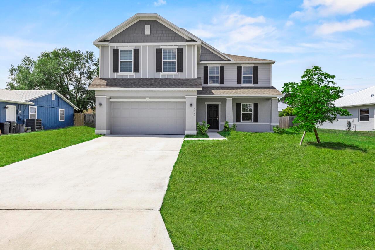 Welcome to your family's next home! This spacious 5-bedroom, 3-bathroom gem with a 2-car garage is perfectly located in Port St. Lucie, close to parks, great schools, and easy access to major highways for commuting. Built in 2022, this home offers a welcoming covered front porch and durable tile floors that are both stylish and kid-friendly. The open-concept living and dining area flows into a beautifully designed kitchen featuring soft-close shaker cabinets, a large island for family meals or homework time, a walk-in pantry, and stainless steel appliances. Upstairs, you'll find a versatile loft--perfect for a playroom, media area, or homework hub--plus a spacious closet for added storage.