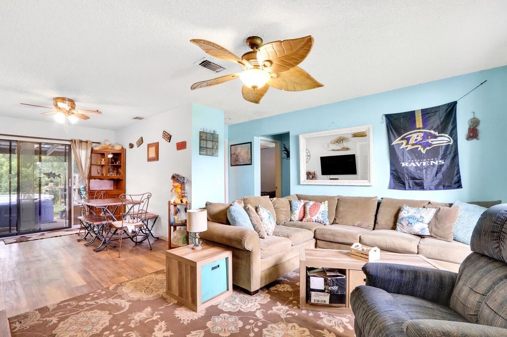 Photo of 1525 SW Pitts Avenue, Port Saint Lucie, FL 34953 (MLS # R10977092)