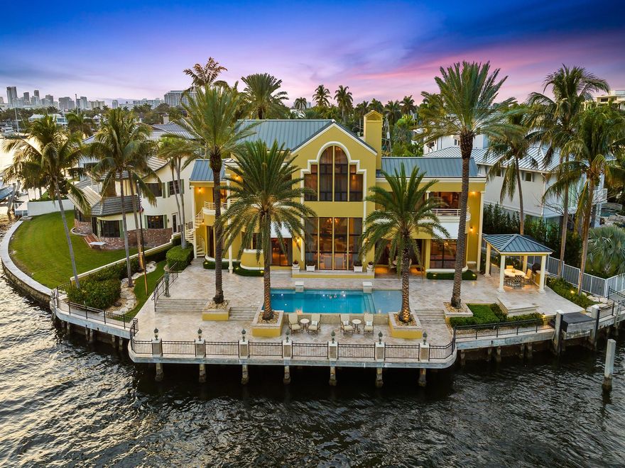 Experience the ultimate in waterfront luxury! An exceptional property that offers a fabulous opportunity to own a signature point lot on an expansive 11,550 SF lot with 158' of breathtaking Intracoastal Waterway. This custom 3-story estate boasts breathtaking views of the Intracoastal & lush Birch State Park from every room. Exquisite great room, complete w/a dual fireplace & 25-foot ceilings,is flooded w/natural light. 4 upper ensuite bedrooms can be easily accessed via the grand staircase or by elevator, each offering exterior terraces w/spectacular water views. The 3rd floor is dedicated to the luxurious principal bedroom, offering a private & lavish retreat. Step outside & indulge in the outdoor paradise, featuring illuminated stone terraces, a summer kitchen, & a luxurious pool.