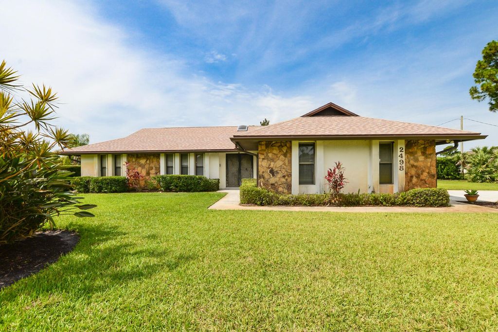 Photo of 2498 SE Hillard Road, Port St Lucie, FL 34952 (MLS # R10898501)