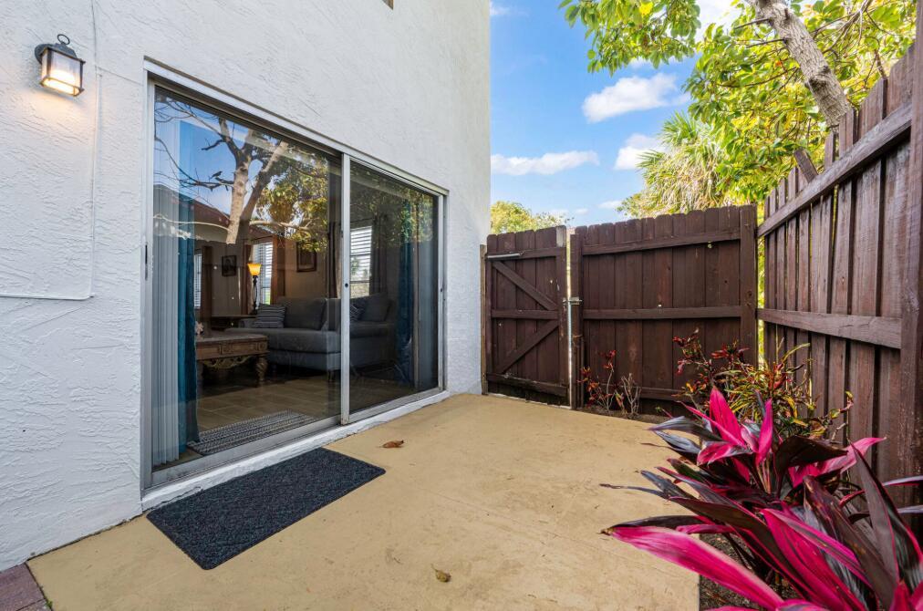 Quiet & comfortable 2 bedroom, 2 full bath with private fenced in patio. Full kitchen with microwave, dishwasher and cookware and dishes. Open living & dining area comfortably furnished with a fold out bed in couch. Bedrooms provide 1 queen size bed & twin beds. Master bedroom has private bath with large shower & another has patio access. Beautiful waterfront community fenced yard w/patio & grill. Coin operated w/d on ground floor. Kick back & relax in this calm, stylish space. Enclosed back patio, great for grilling!