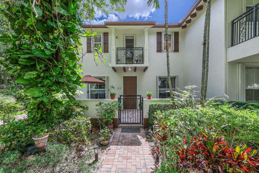 Discover this corner end  3-bedroom with den townhouse in the desirable Paloma Lakes, just a block away from the vibrant Promenade of Coconut Creek, where fine dining, shopping, and entertainment are next door. This spacious home with one of the largest square footage features an abundance of space filled with natural light and serene views of the preserve from your private courtyard facing west. The open concept layout downstairs with an eat in kitchen overlooks the inviting living and dining areas and is perfect for entertaining, . Upstairs the luxurious primary suite boasts a vaulted ceiling, a large walk-in closet, and an oversized bathroom, providing a perfect retreat.  There too you will also find two ample sized bedrooms and second floor laundry. AC 2019, Water Heater 2023.