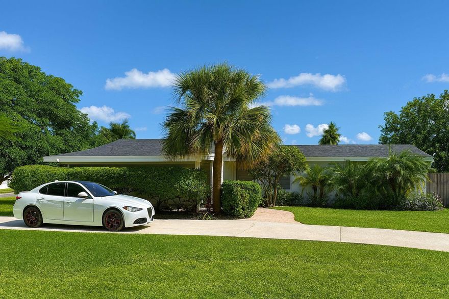 Welcome to this spacious corner-lot home featuring 3 bedrooms and 2 bathrooms, located in a highly desired community!NEW ROOF 2024! Enjoy an enclosed patio perfect for relaxing or entertaining, a roundabout driveway, and plenty of space to park your boat or RV. Conveniently located just minutes from the highway, Palm Beach Zoo, and other popular recreational areas--this home offers comfort, convenience, and versatility all in one.